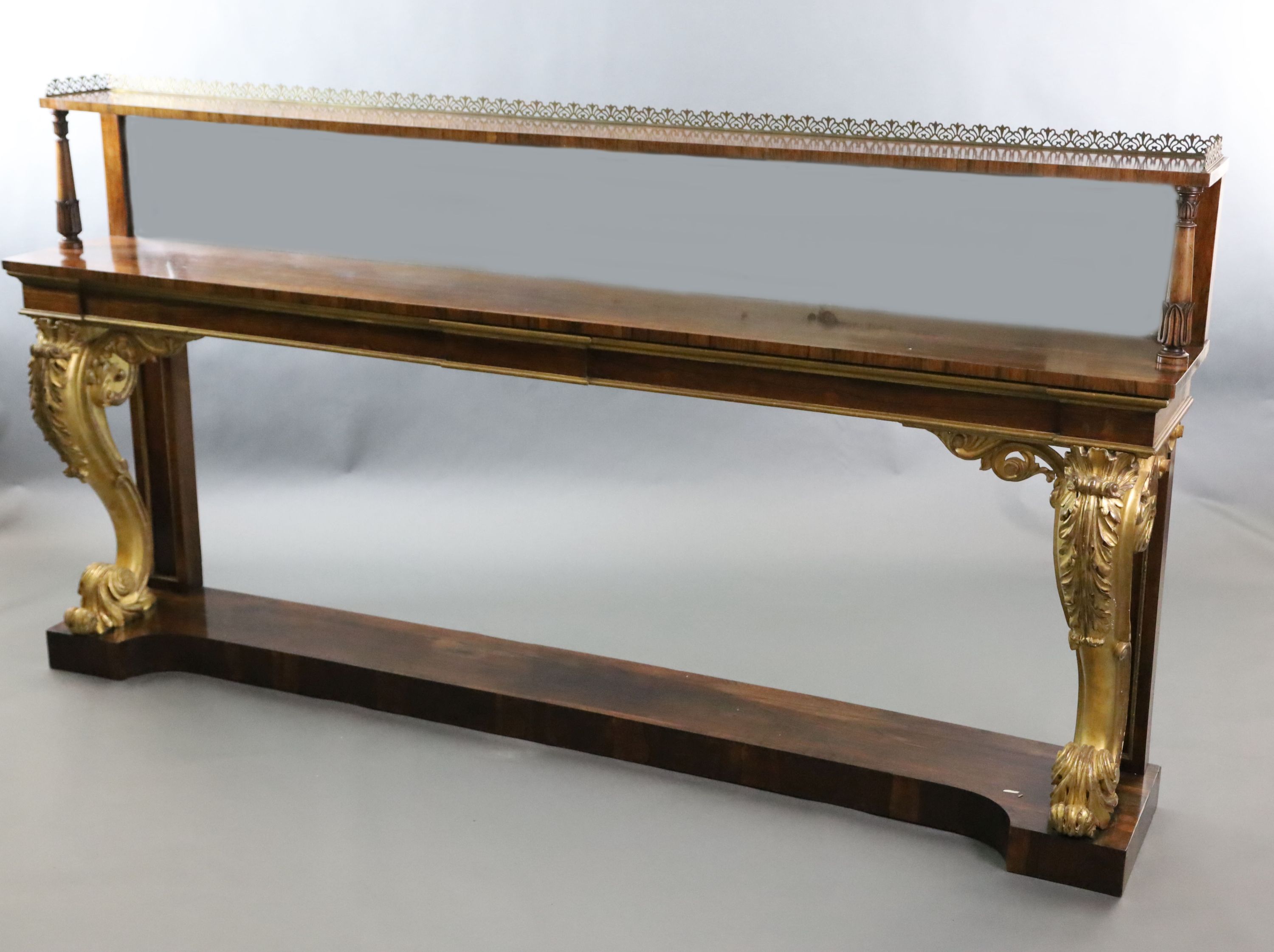 A pair of William IV parcel gilt rosewood console tables, W.8ft 2in. D.1ft 4in. H.4ft 4in.